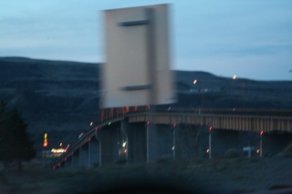 Bad photo of bridge, accidentally obscured by a road sign